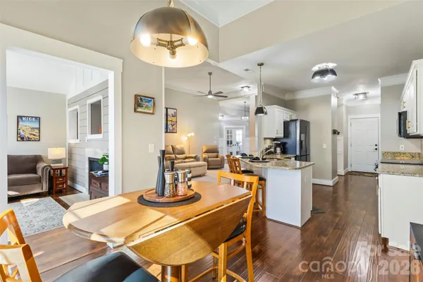 a view of a dining room with furniture and wooden floor
