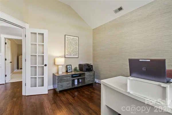 a view of a livingroom with furniture and wooden floor