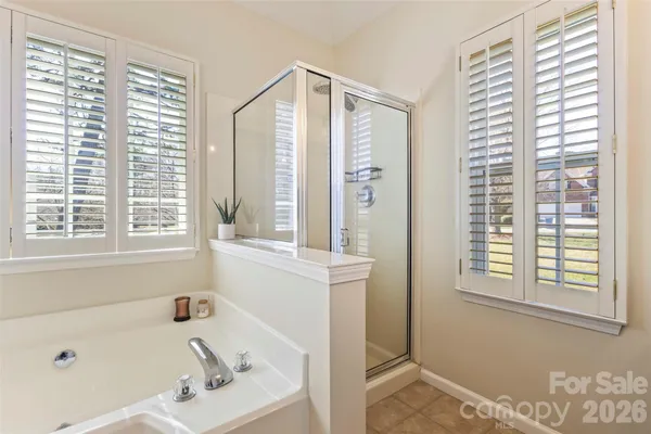 a bathroom with a bathtub and a sink