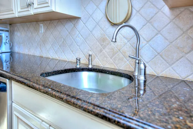 a view of a hallway with wooden floor and entryway