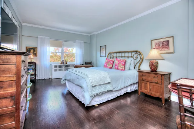 a bedroom with bed and a window