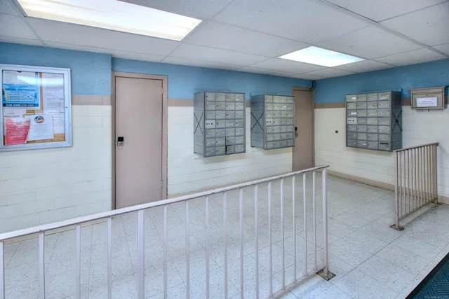 a dining room with furniture and a chandelier
