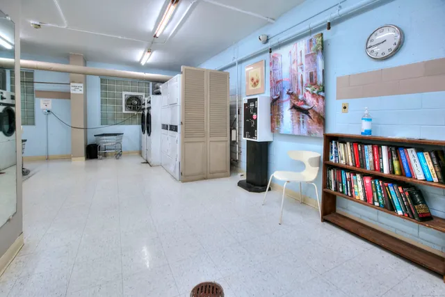 a dining room with furniture and a clock
