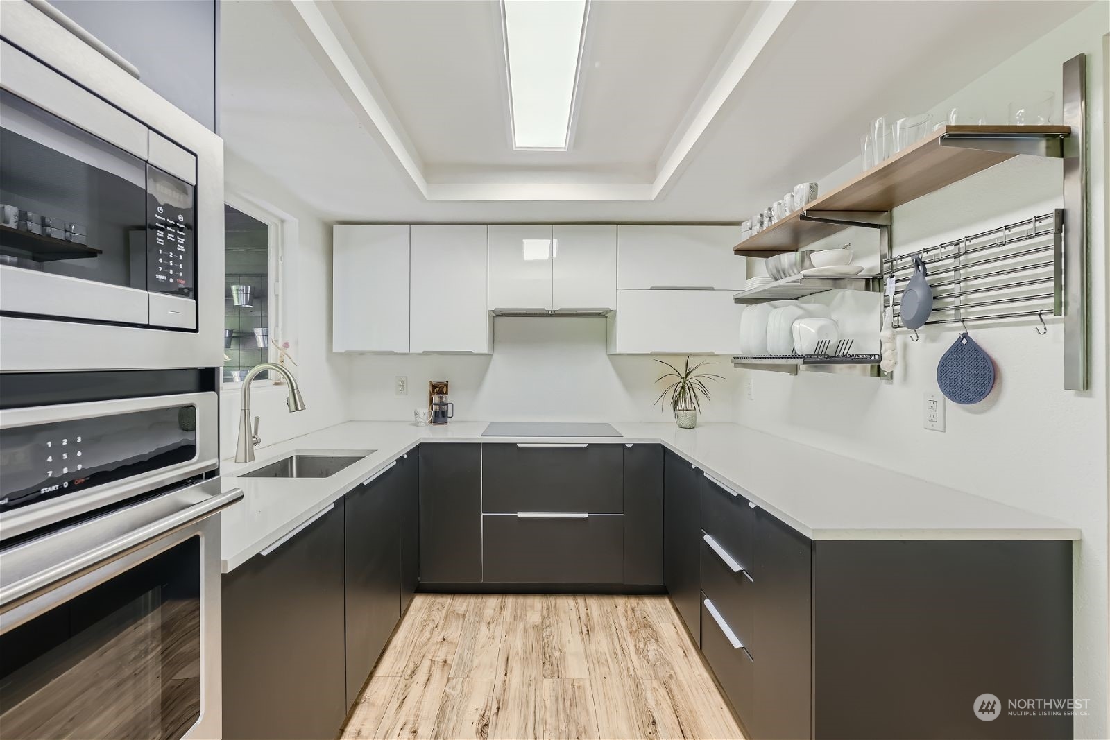 2622 168th Street Southeast Bothell, WA 98012 - Photo 11 of 29 a kitchen with a sink dishwasher and wooden cabinets