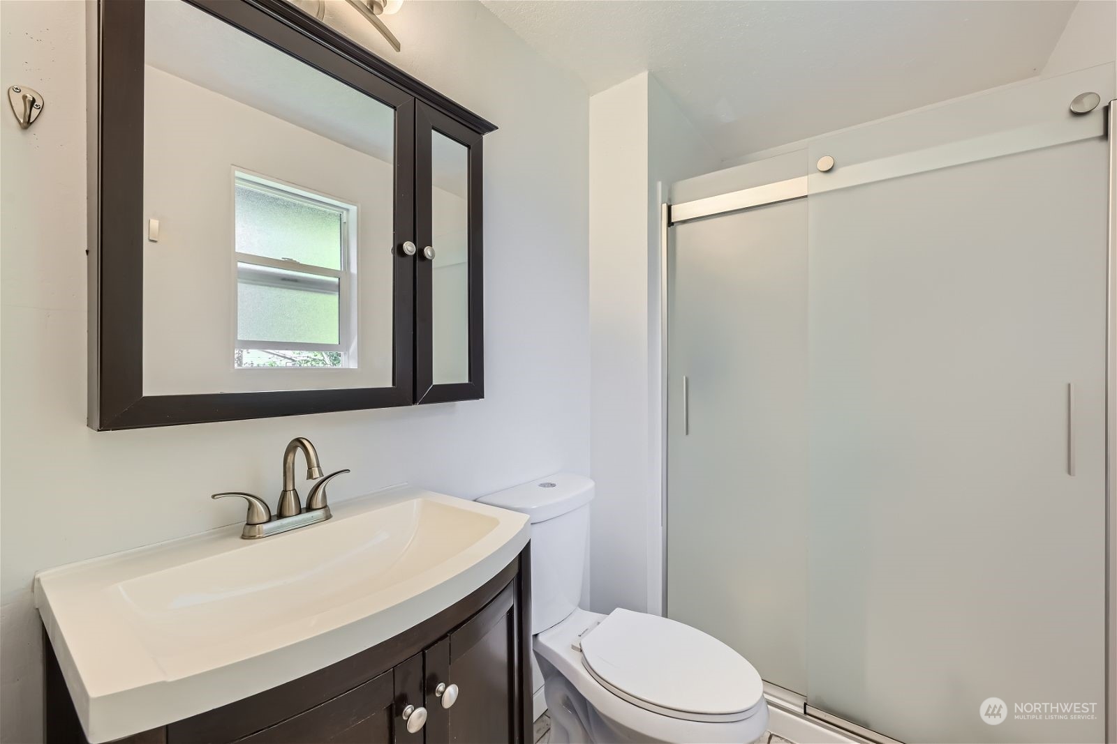 2622 168th Street Southeast Bothell, WA 98012 - Photo 15 of 29 a bathroom with a sink a toilet and mirror