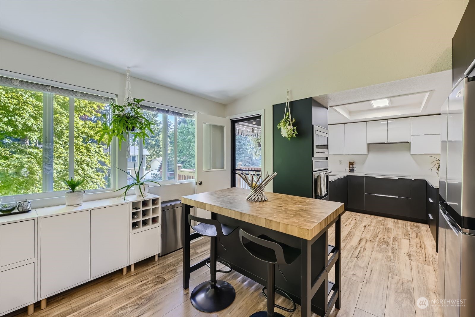 2622 168th Street Southeast Bothell, WA 98012 - Photo 8 of 29 a kitchen with a table chairs and a refrigerator