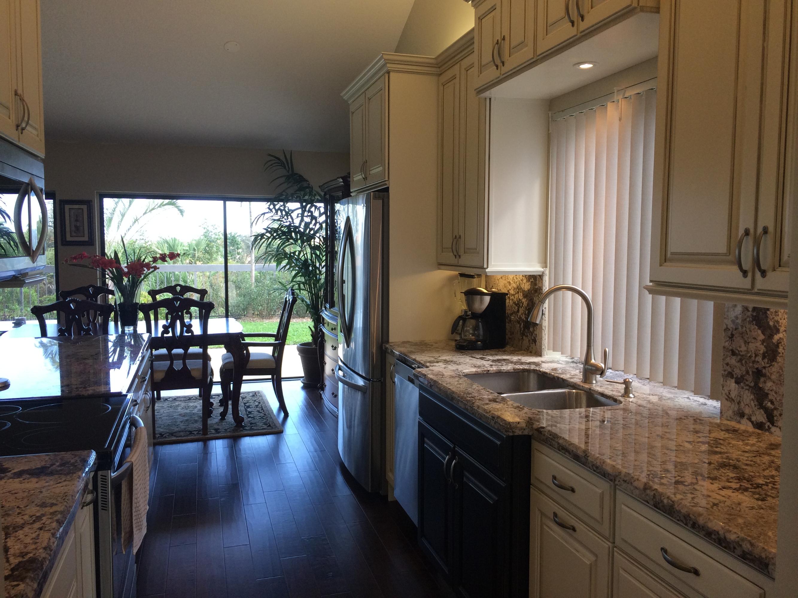189 Ridge Road Jupiter, FL 33477 - Photo 3 of 38 Kitchen View From Foyer