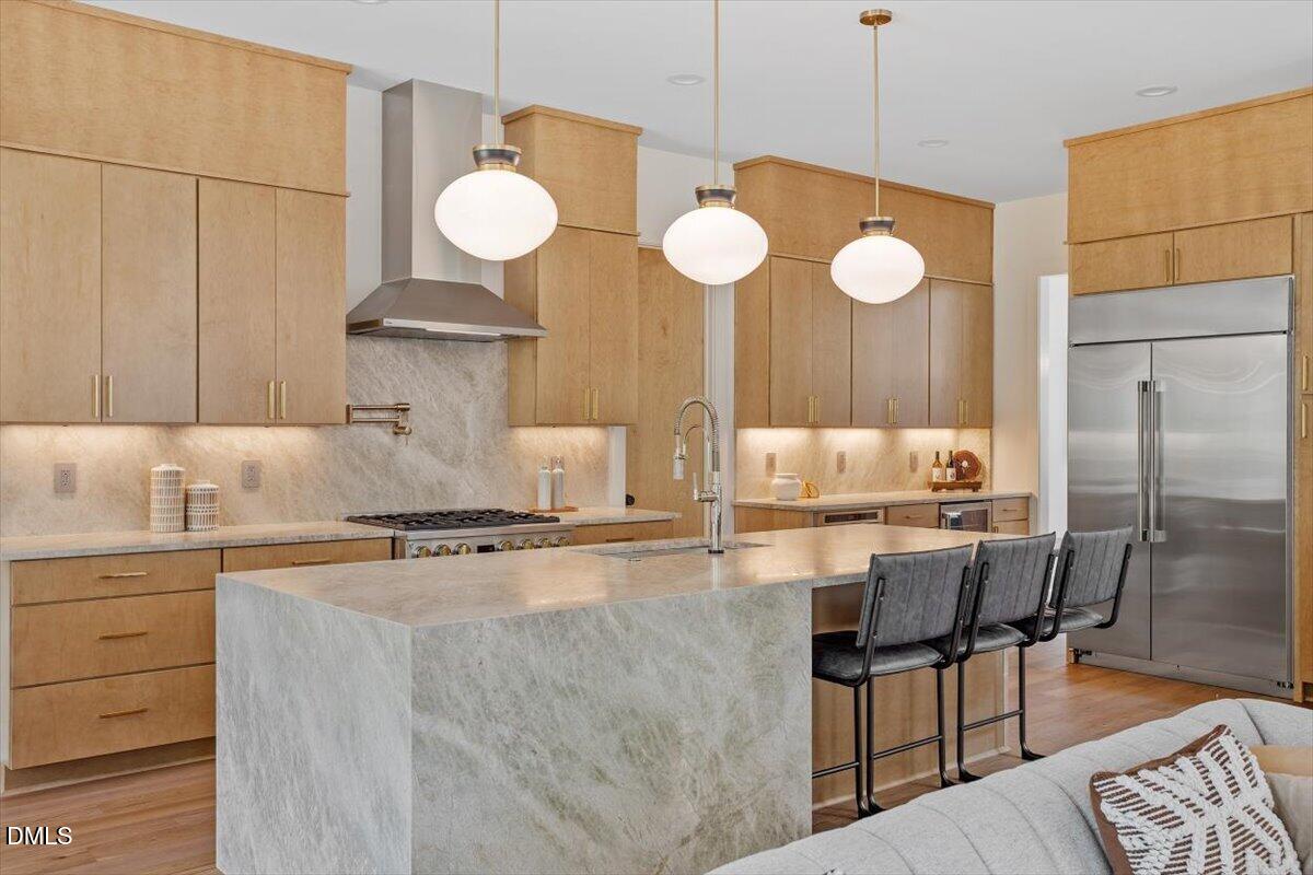 1213 Brookside Drive Raleigh, NC 27604 - Photo 17 of 50 a kitchen with a table chairs and a chandelier
