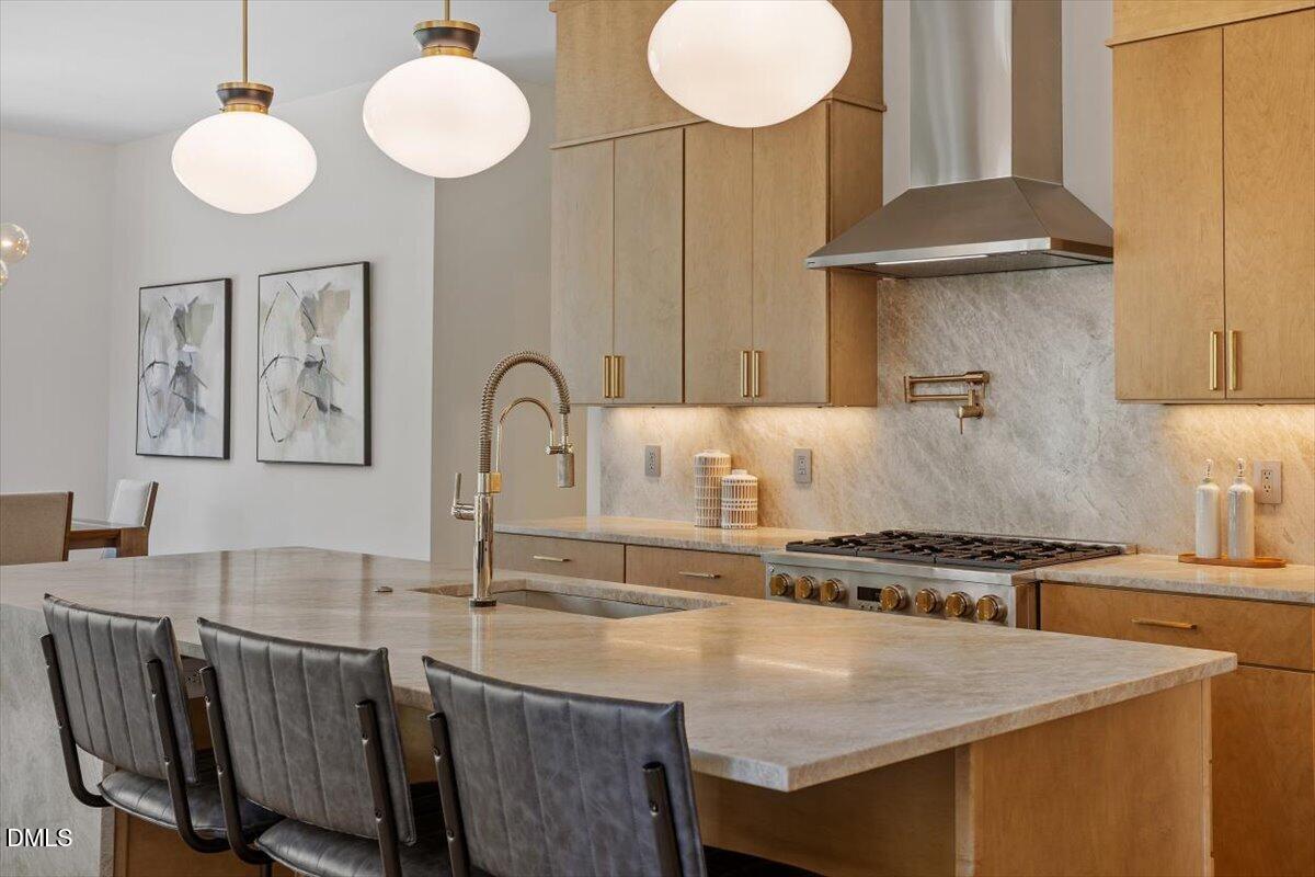 1213 Brookside Drive Raleigh, NC 27604 - Photo 19 of 50 a kitchen with a table chairs and a stove