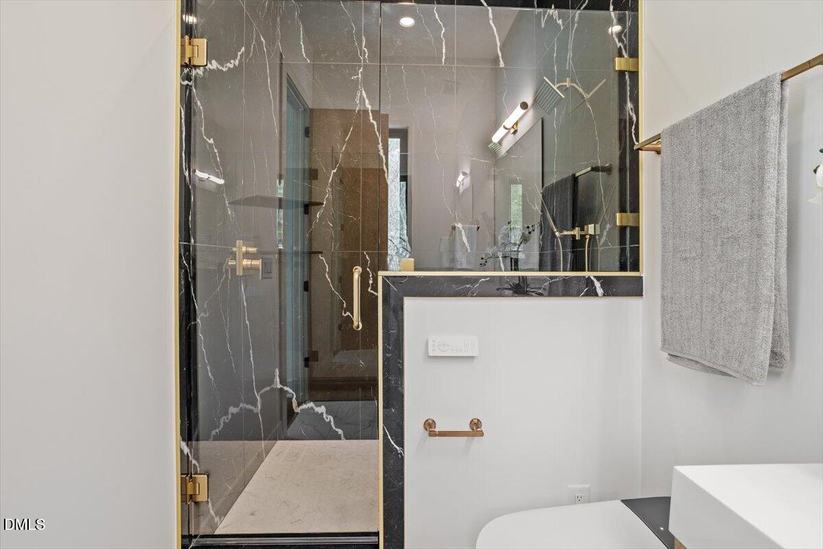 1213 Brookside Drive Raleigh, NC 27604 - Photo 30 of 50 a bathroom with a sink and mirror with toilet