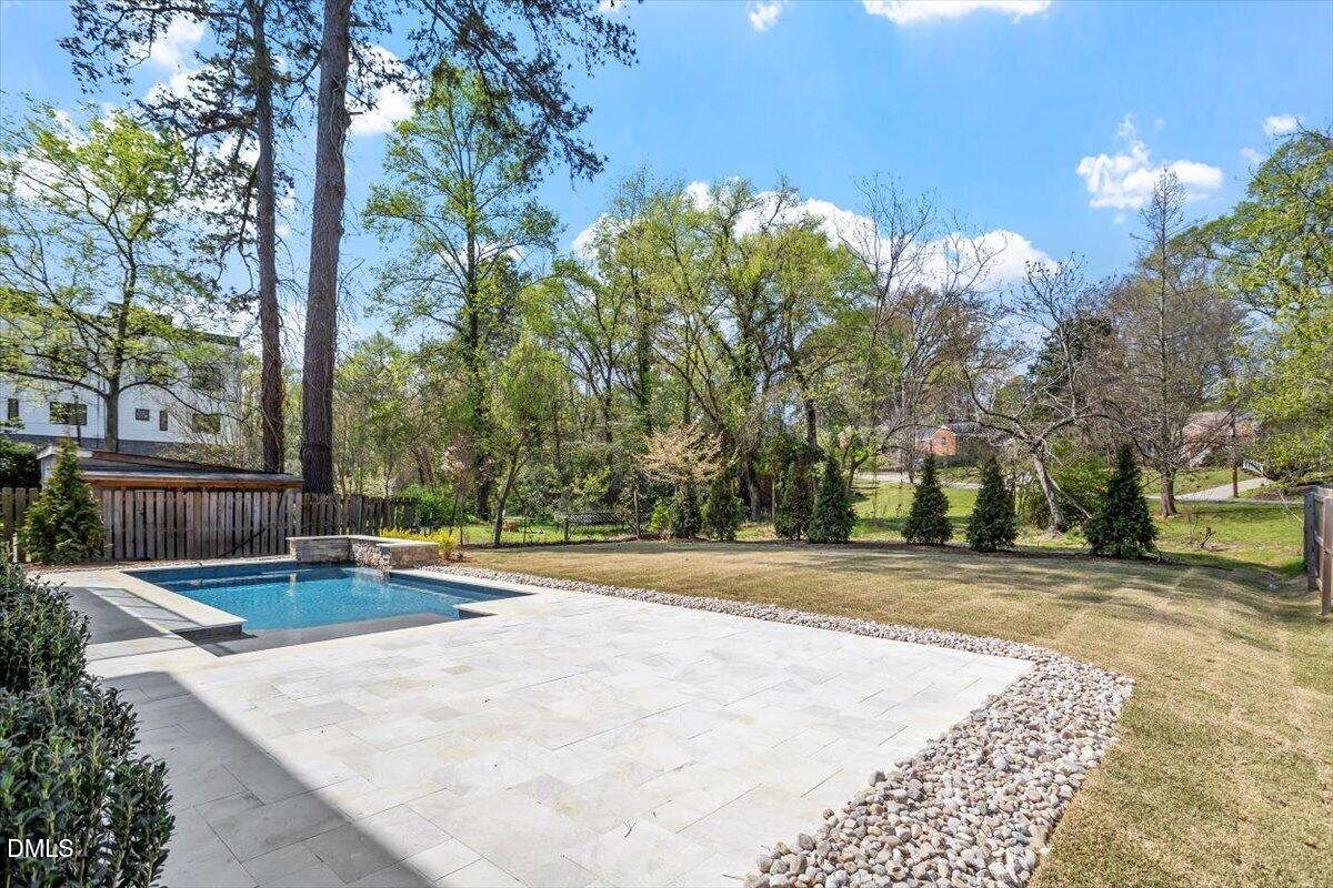 1213 Brookside Drive Raleigh, NC 27604 - Photo 4 of 50 a view of a swimming pool with an outdoor space and seating area