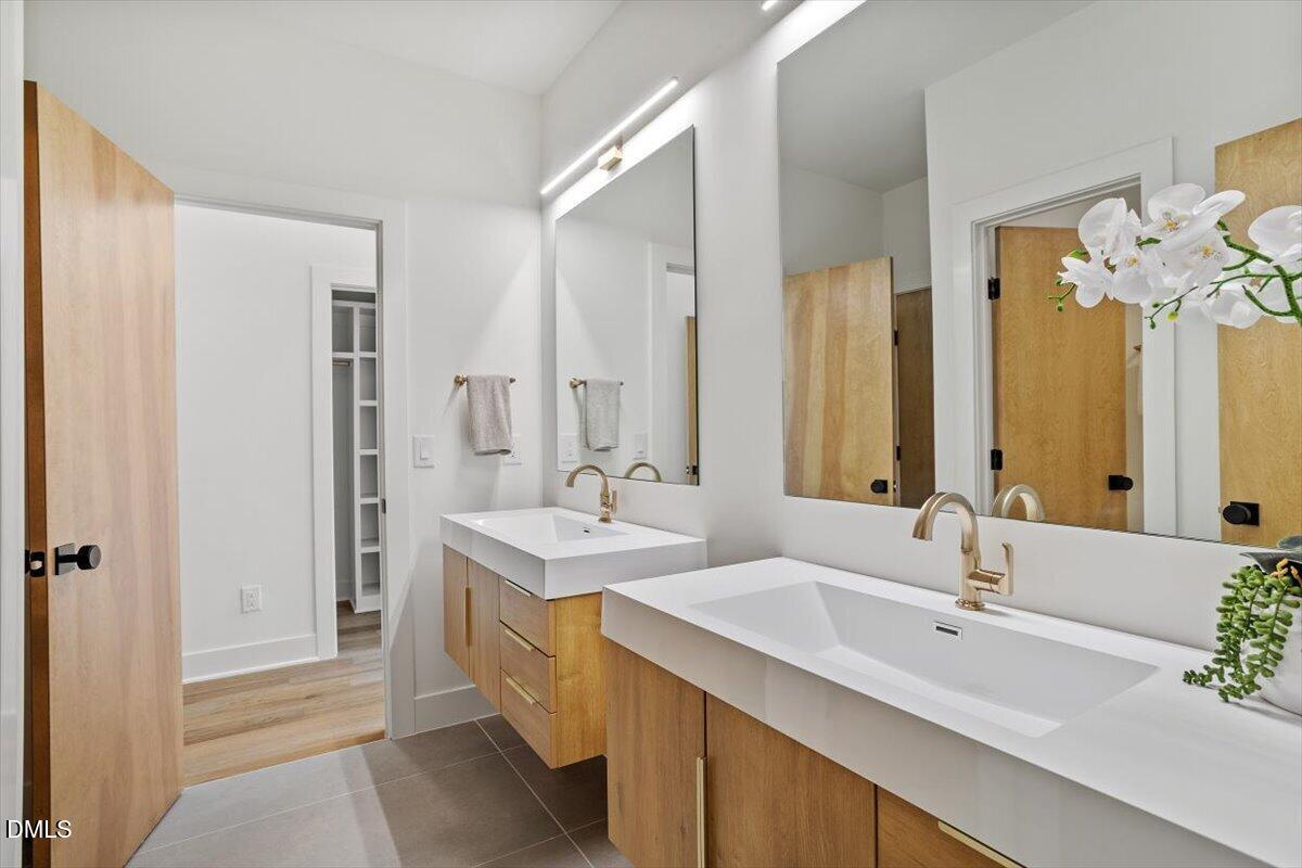 1213 Brookside Drive Raleigh, NC 27604 - Photo 41 of 50 a bathroom with a double vanity sink mirror and double