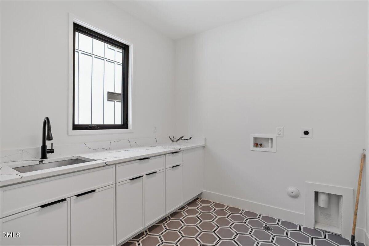 1213 Brookside Drive Raleigh, NC 27604 - Photo 42 of 50 a bathroom with a sink and a mirror