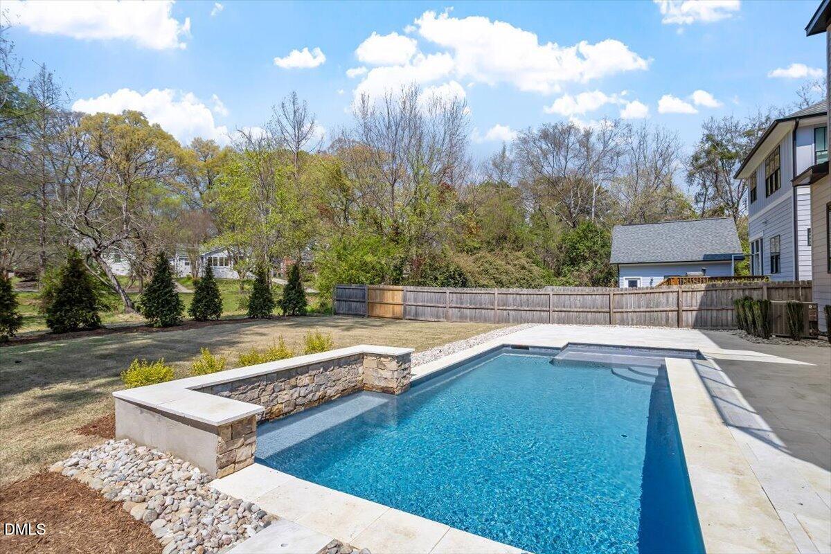 1213 Brookside Drive Raleigh, NC 27604 - Photo 5 of 50 a view of a swimming pool with a patio and a yard