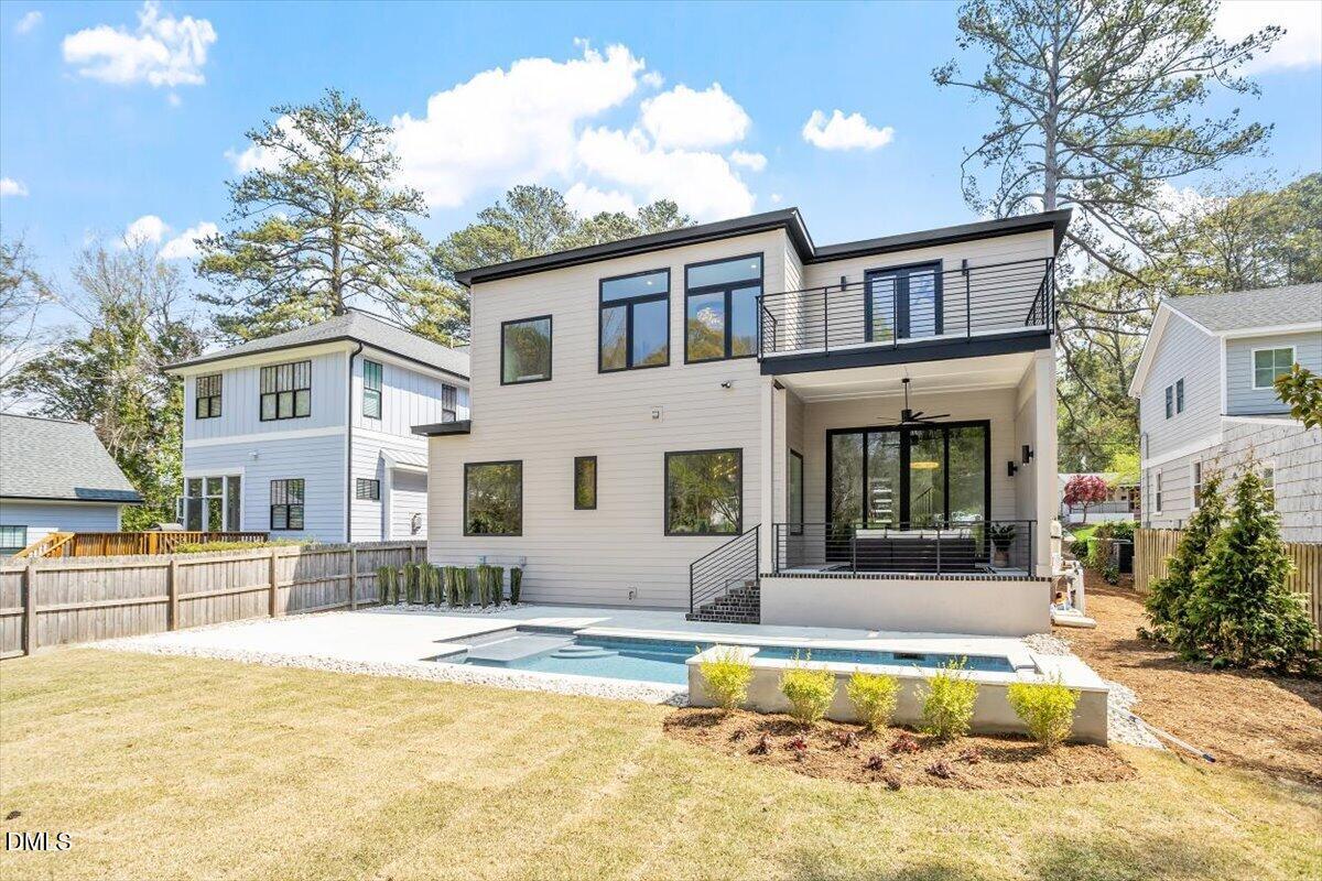 1213 Brookside Drive Raleigh, NC 27604 - Photo 6 of 50 a view of a house with swimming pool and a porch with furniture