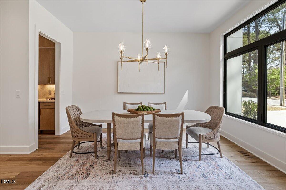 1213 Brookside Drive Raleigh, NC 27604 - Photo 7 of 50 a view of a dining room with furniture window and outside view