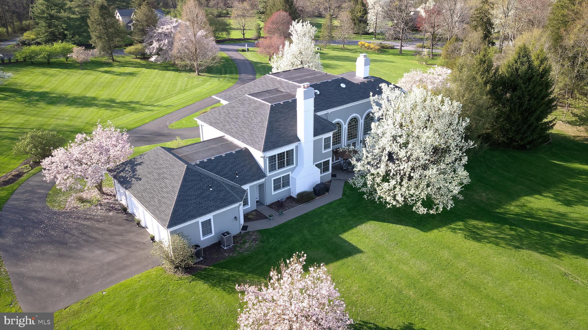 Aerial view of the 4 bay garage and the driveway.