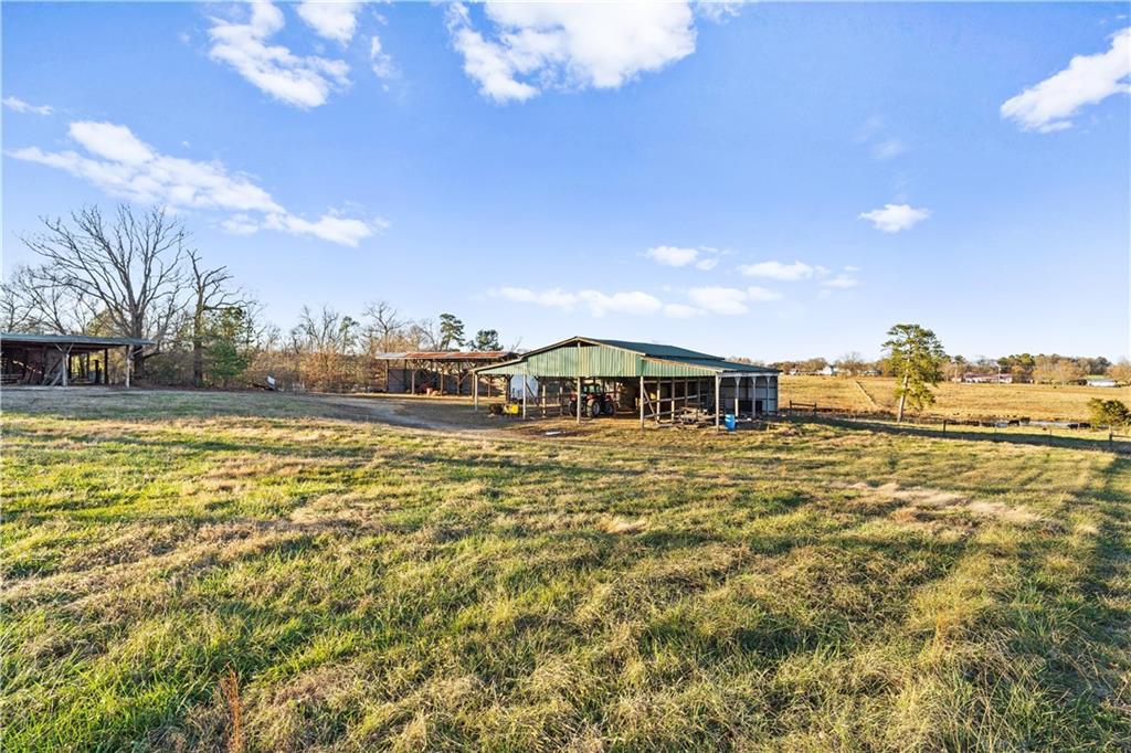 2113 Union Grove Church Road Southeast Adairsville, GA 30103 - Photo 14 of 36 a front view of a house with a yard
