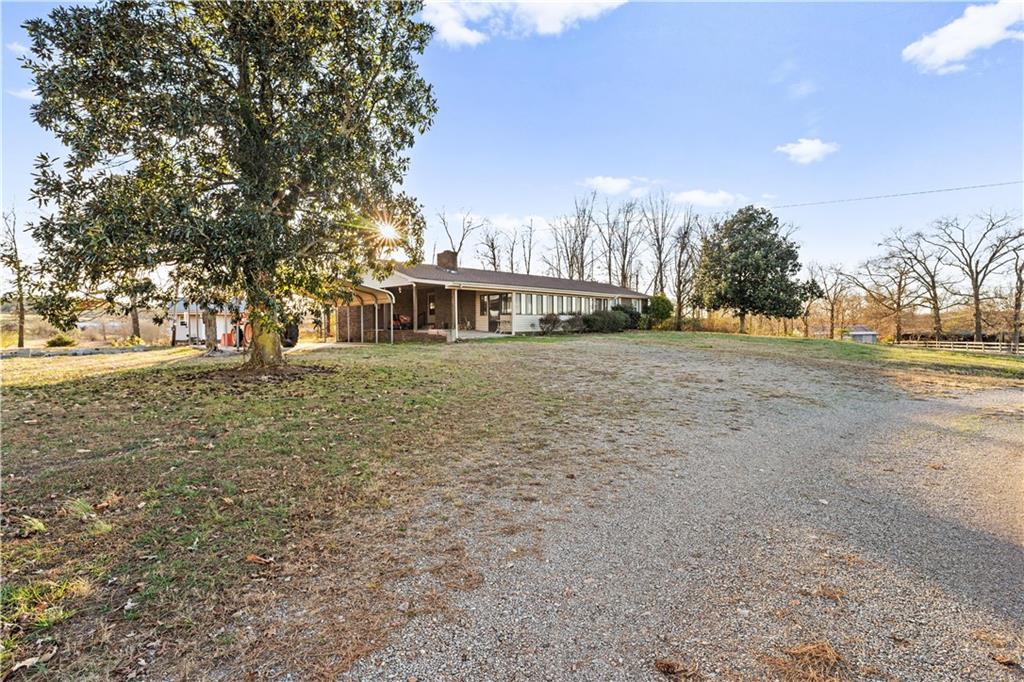 2113 Union Grove Church Road Southeast Adairsville, GA 30103 - Photo 21 of 36 a view of a house with a yard and trees