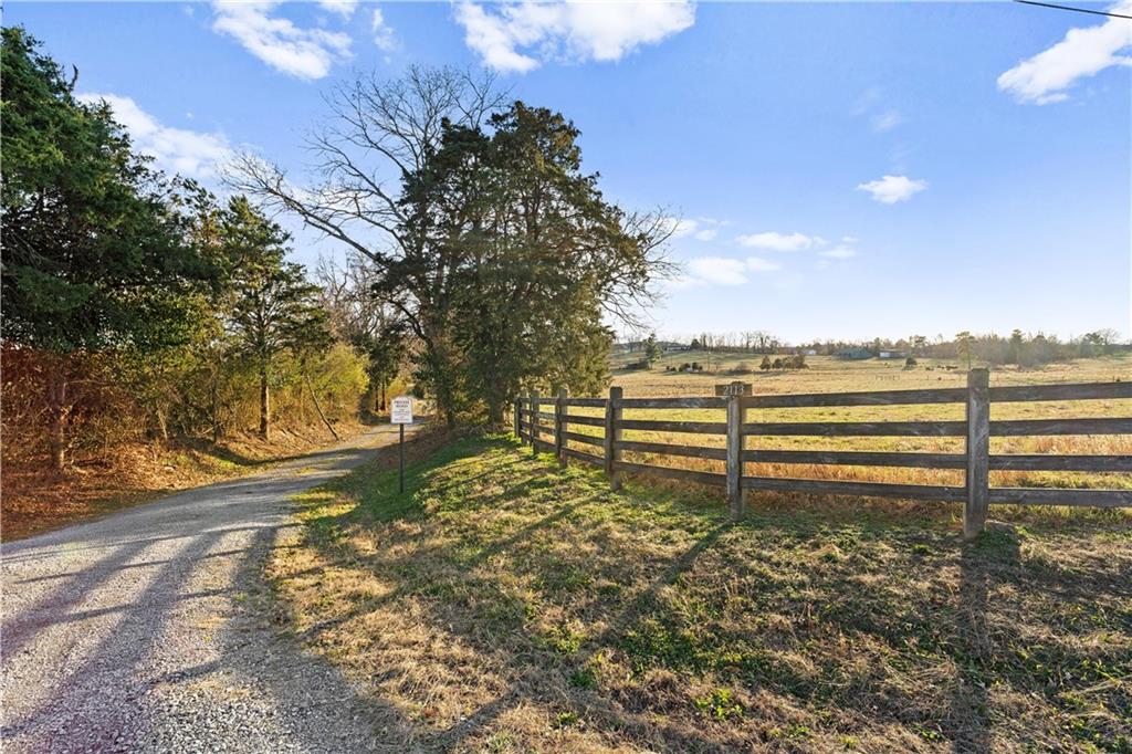 2113 Union Grove Church Road Southeast Adairsville, GA 30103 - Photo 25 of 36 a view of a big yard with wooden fence