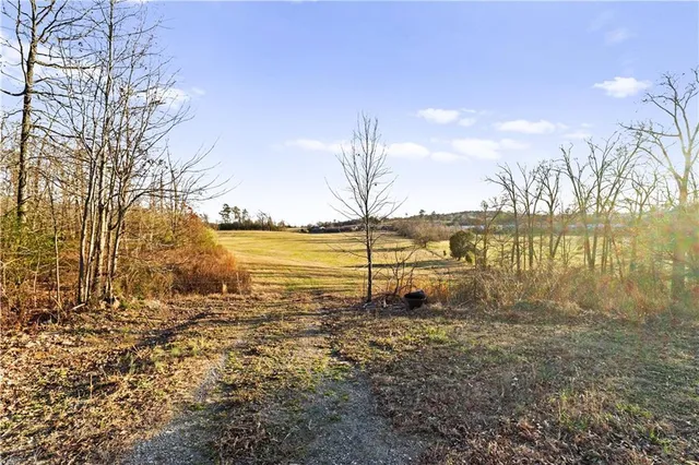 a large body of water with a building in the background