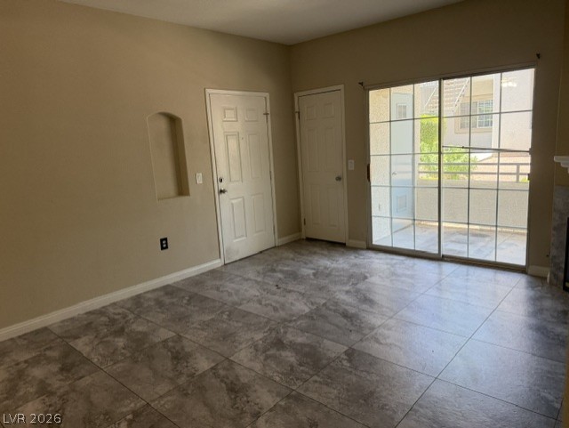 3318 North Decatur Boulevard, Unit 1163 Las Vegas, NV 89130 - Photo 3 of 35 Natural light streams into this versatile space with elegant tile flooring and direct access to an outdoor area.