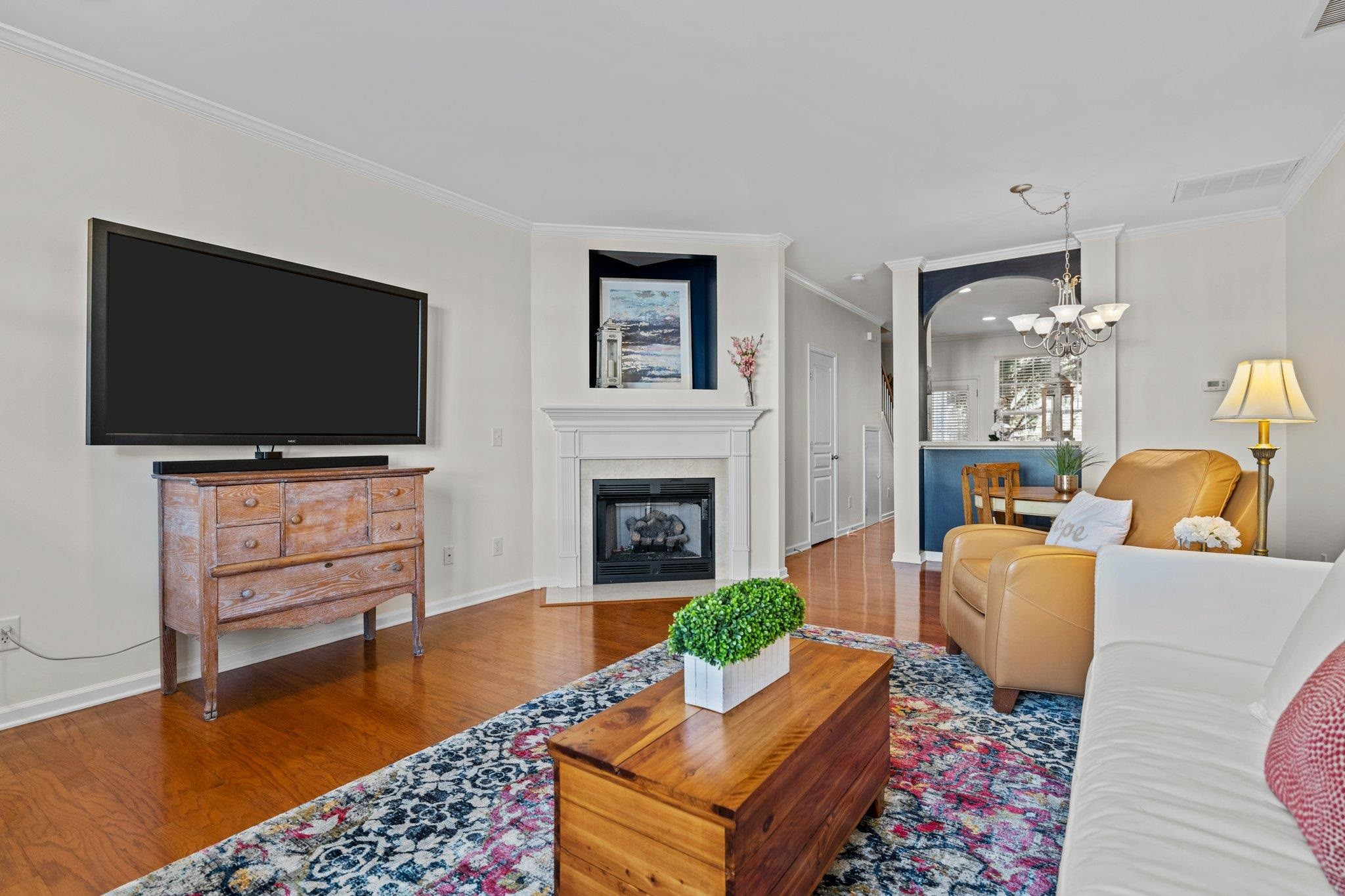 Living room features corner gas fireplace with built-in entertainment niche. Move-in ready for cozy fall nights! GAS FIREPLACE