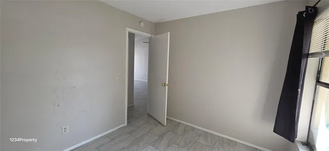 a view of hallway with a window