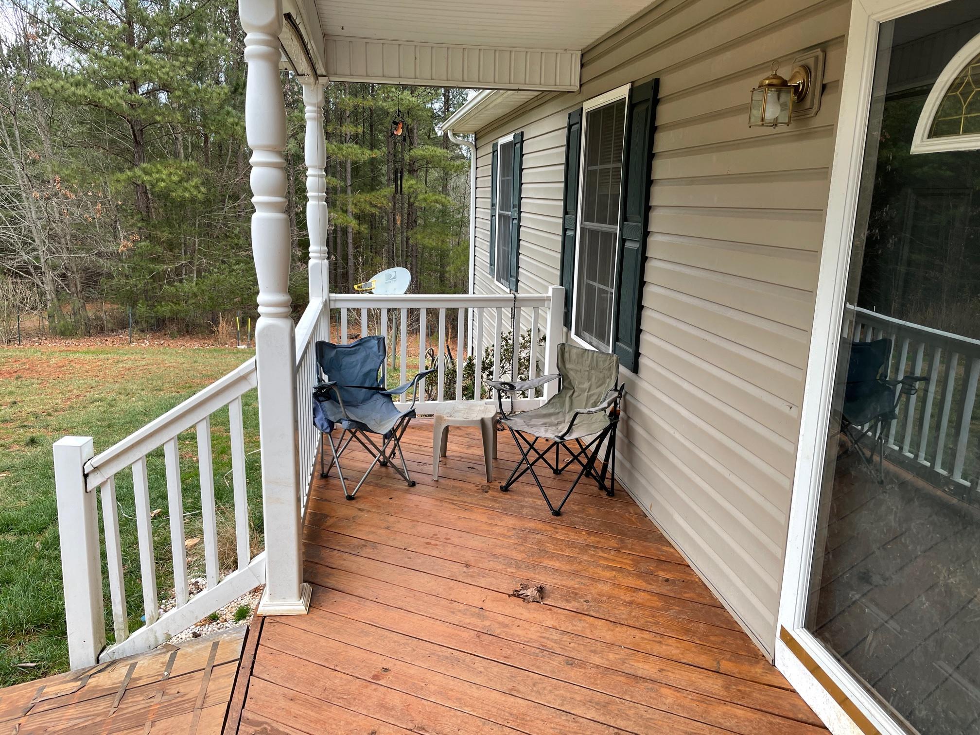 778 Holland Road Callaway, VA 24067 - Photo 2 of 27 a balcony with wooden floor table and chairs