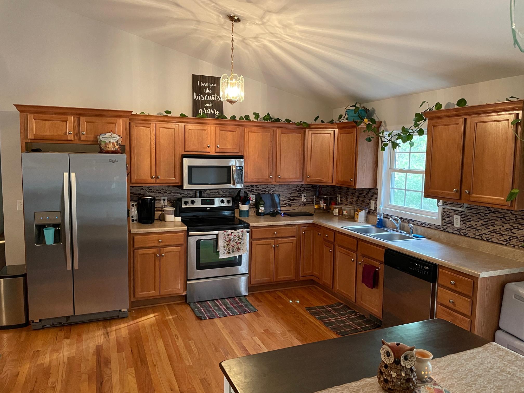 778 Holland Road Callaway, VA 24067 - Photo 12 of 27 a kitchen with granite countertop a refrigerator and a sink
