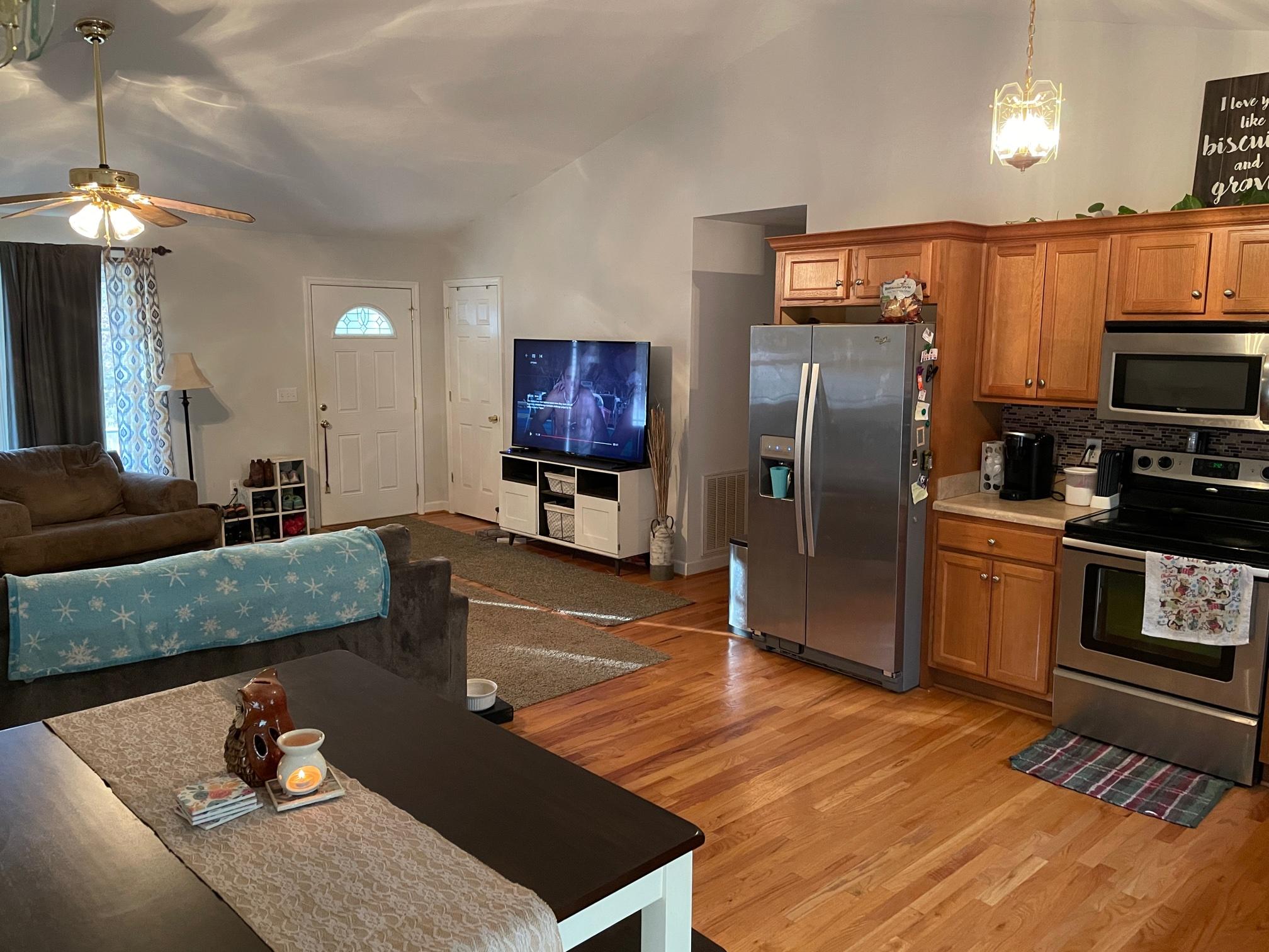 778 Holland Road Callaway, VA 24067 - Photo 13 of 27 a living room with furniture a flat screen tv and kitchen view
