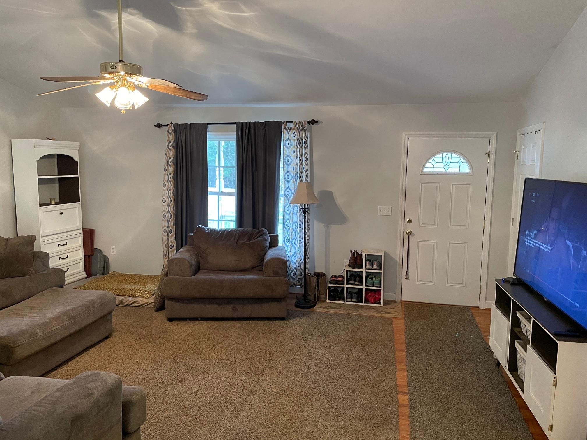 778 Holland Road Callaway, VA 24067 - Photo 3 of 27 a living room with furniture and a flat screen tv