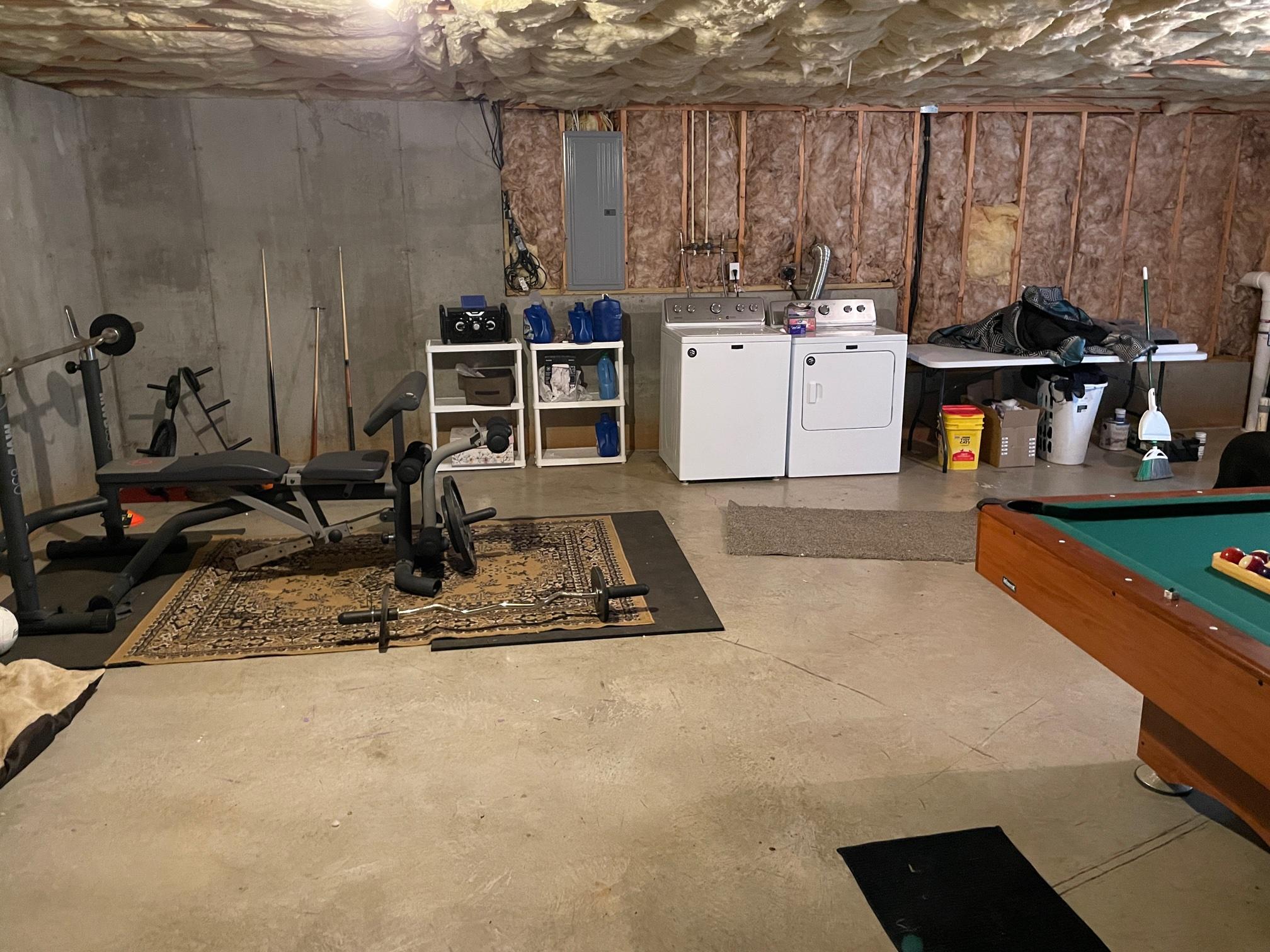 778 Holland Road Callaway, VA 24067 - Photo 21 of 27 a room with gym equipment and view of living room