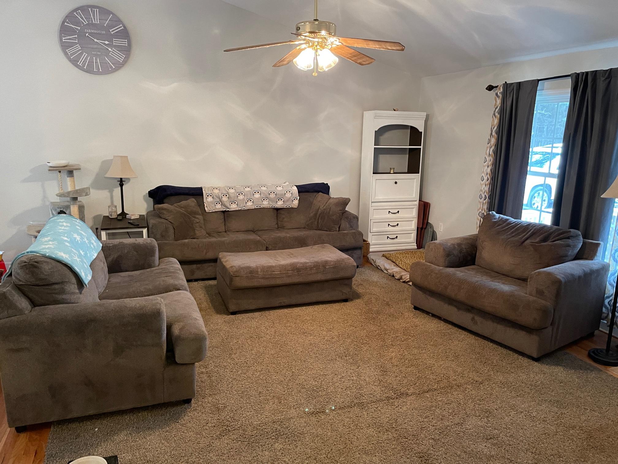 778 Holland Road Callaway, VA 24067 - Photo 4 of 27 a living room with furniture and a chandelier