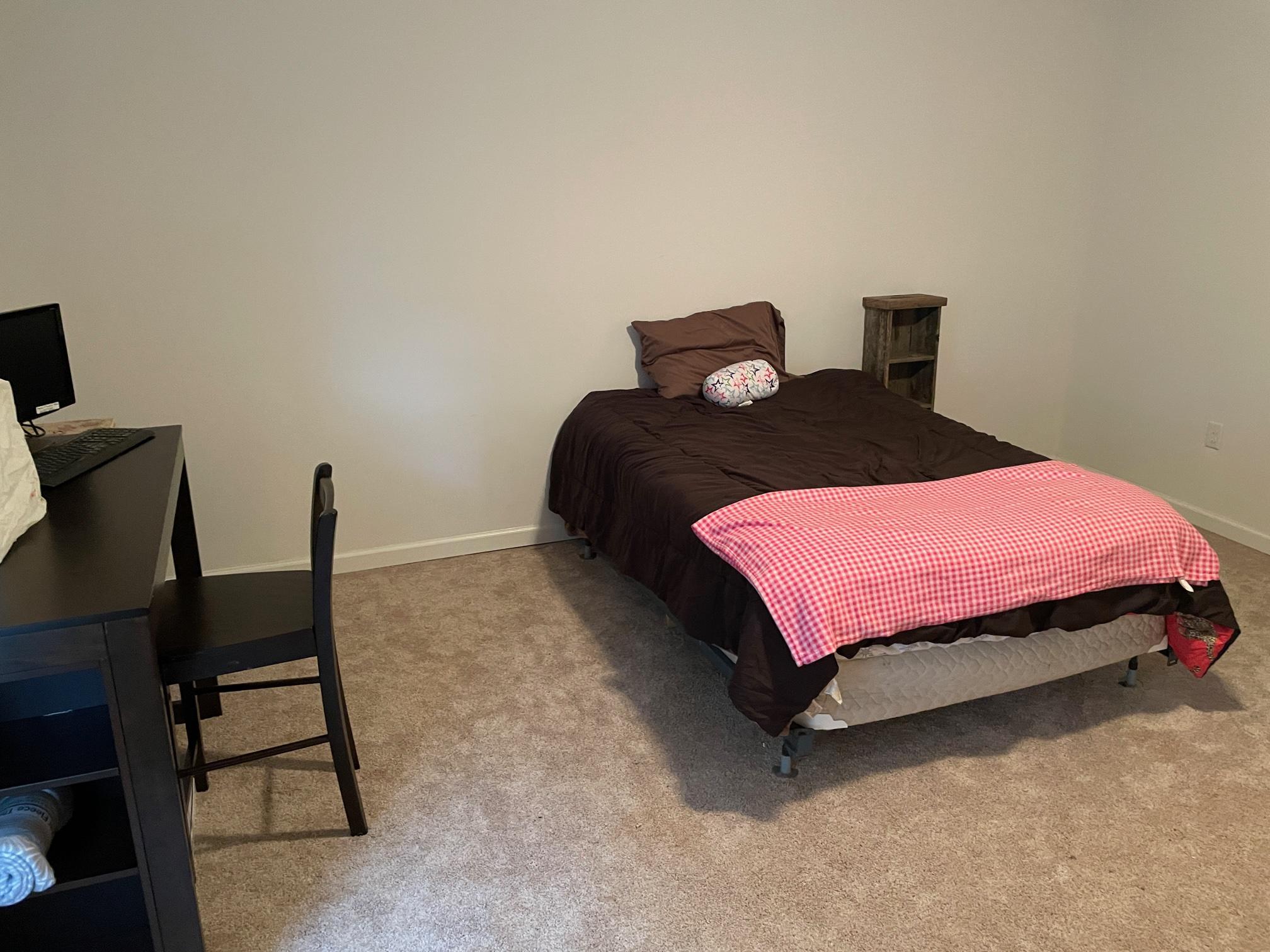 778 Holland Road Callaway, VA 24067 - Photo 6 of 27 a bedroom with a bed and a chair
