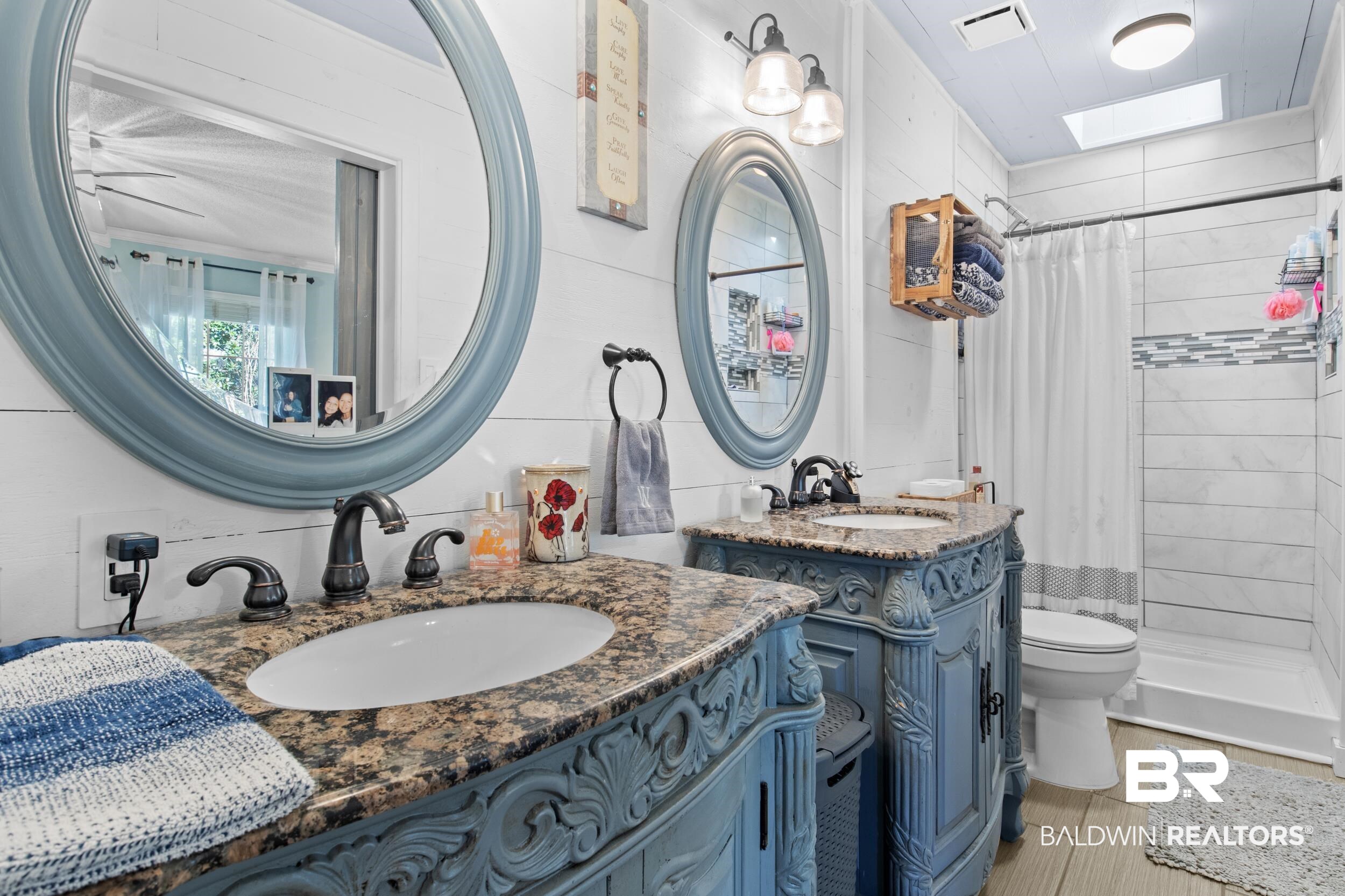 131 Marikesh Drive Daphne, AL 36526 - Photo 10 of 29 Bathroom with walk in shower, vanity, toilet, and a skylight