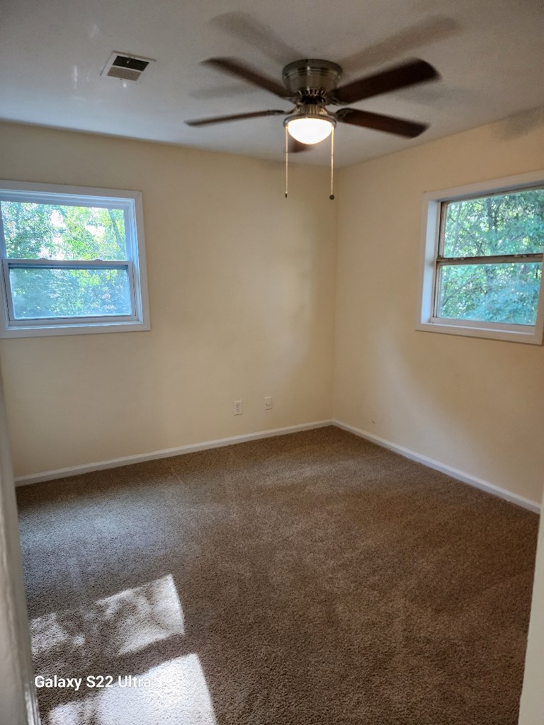 5118 11th Avenue Columbus, GA 31904 - Photo 6 of 12 an empty room with a window