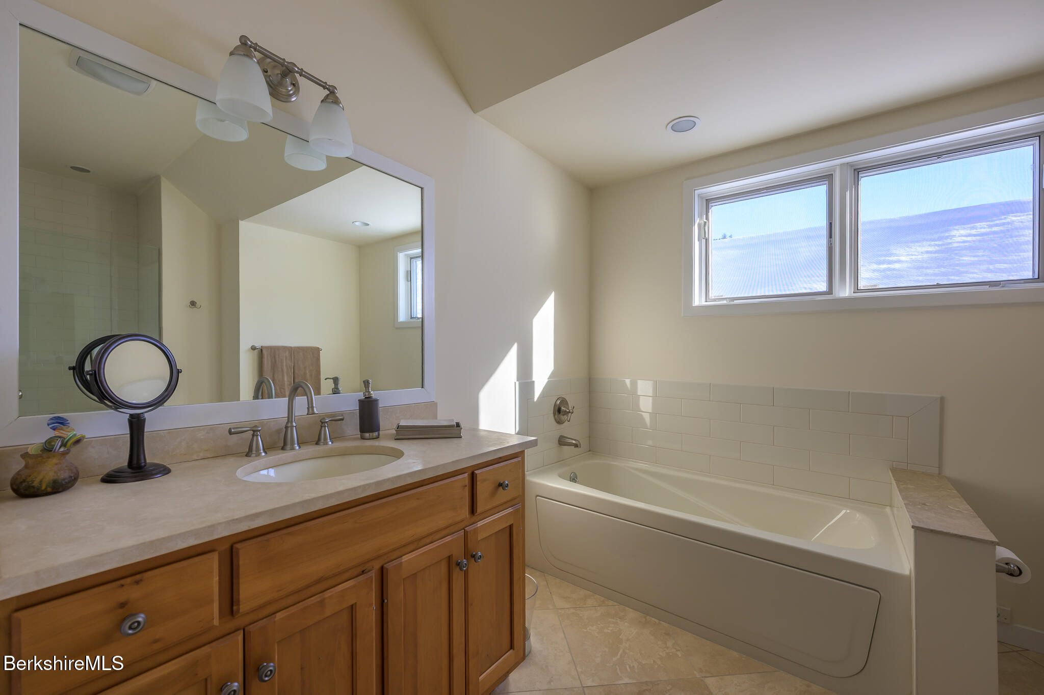 83 Maple Hill Road West Stockbridge, MA 01266 - Photo 56 of 86 a bathroom with a granite countertop sink a toilet and a mirror
