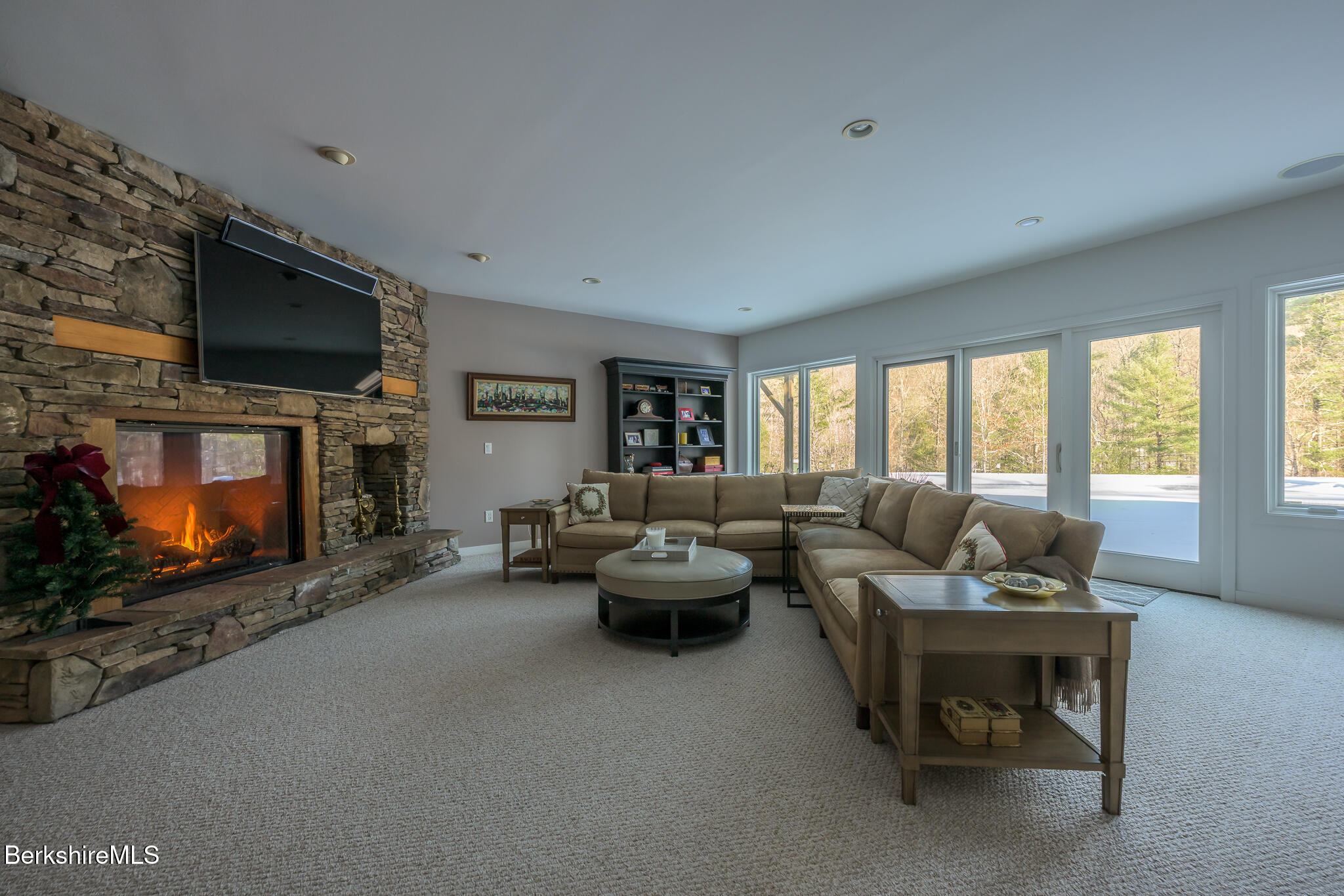 83 Maple Hill Road West Stockbridge, MA 01266 - Photo 59 of 86 a living room with furniture a flat screen tv and a fireplace