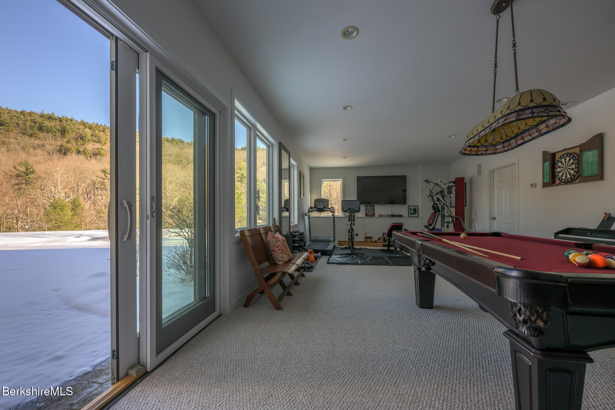 83 Maple Hill Road West Stockbridge, MA 01266 - Photo 63 of 86 a living room with furniture a flat screen tv and a floor to ceiling window