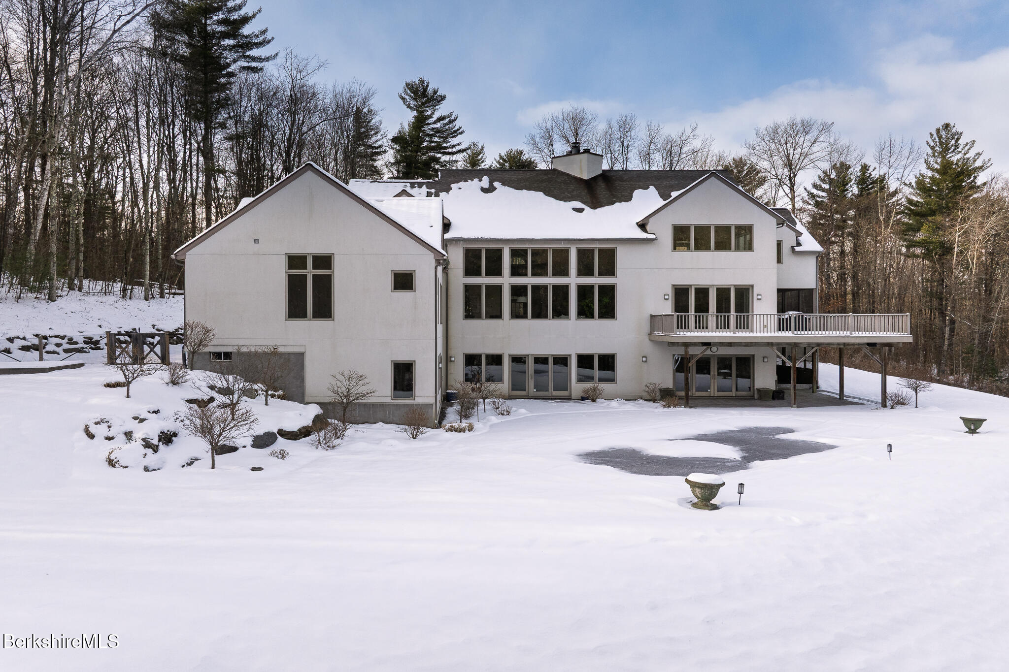 83 Maple Hill Road West Stockbridge, MA 01266 - Photo 80 of 86 a view of a white house with yard and sitting area