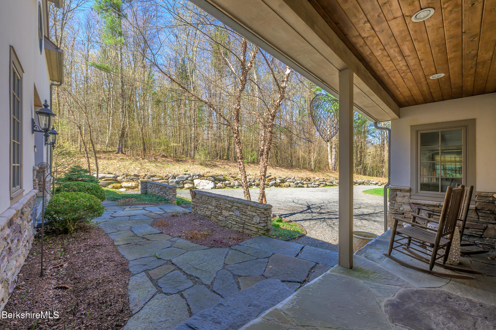 83 Maple Hill Road West Stockbridge, MA 01266 - Photo 9 of 86 a view of a porch with chairs and floor to ceiling window