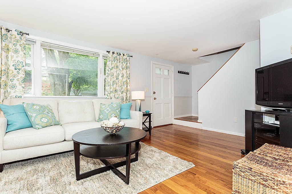5 George Road, Unit 5 Winchester, MA 01890 - Photo 3 of 21 a living room with furniture and a flat screen tv