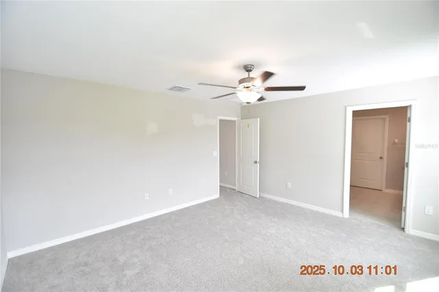 a bathroom with a granite countertop sink a mirror and a shower