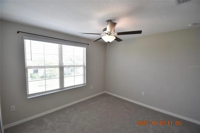 a view of a small space with a fan