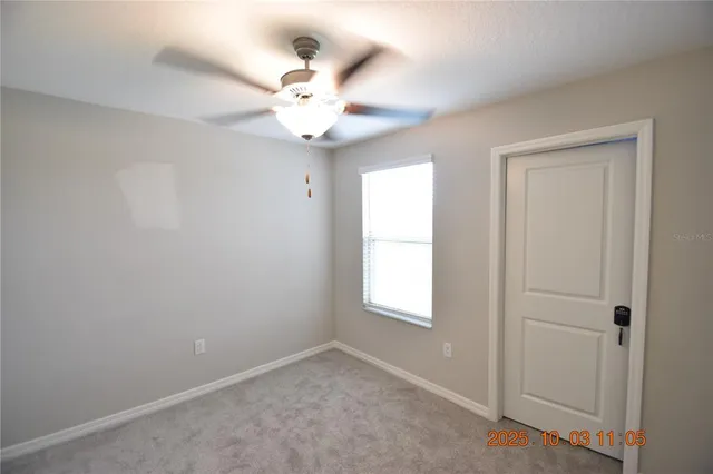 a white toilet sitting next to a bath tub