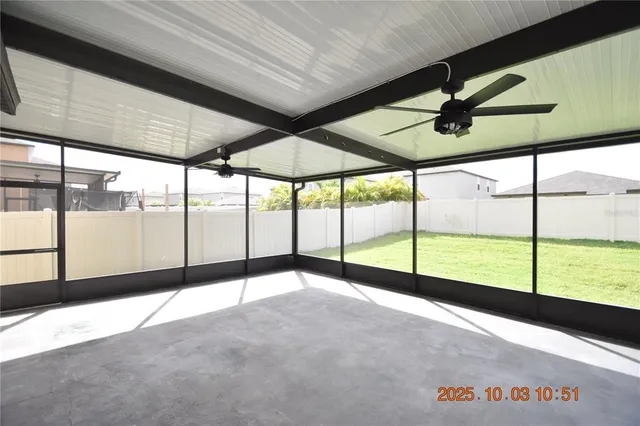 a view of a house with backyard and garden
