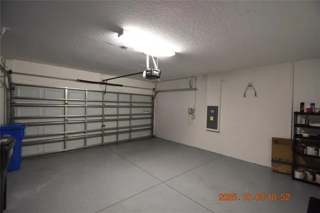 a view of a house with a yard and garage