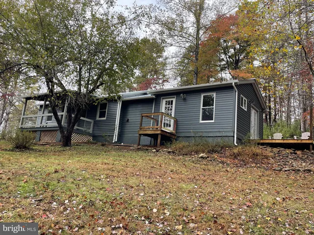 a house with trees in the background