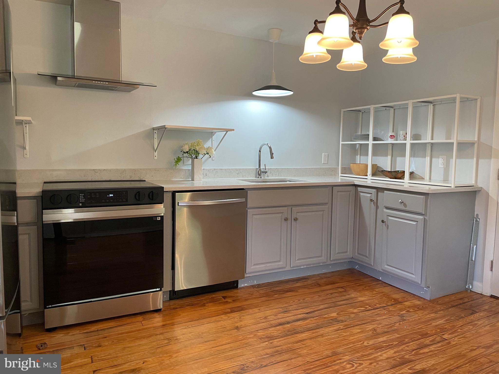 240 Whorton Hollow Road Castleton, VA 22716 - Photo 19 of 24 a kitchen with a stove sink and cabinets